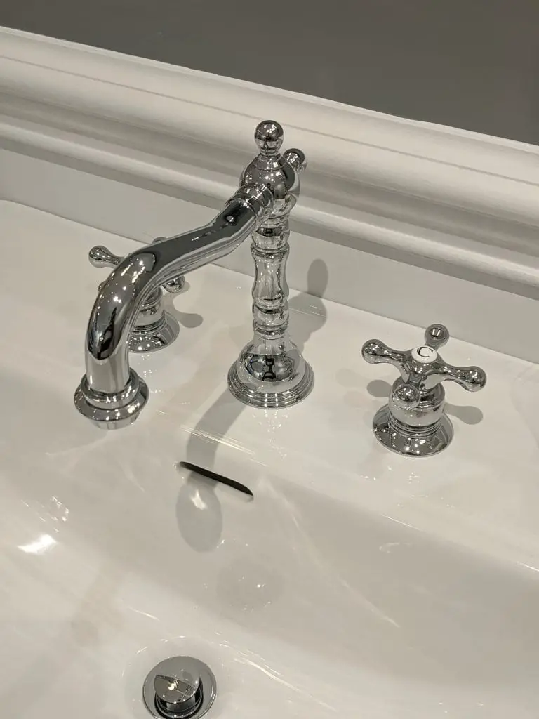 Cross Handle Traditional Bathroom Faucet labeled for hot and cold water